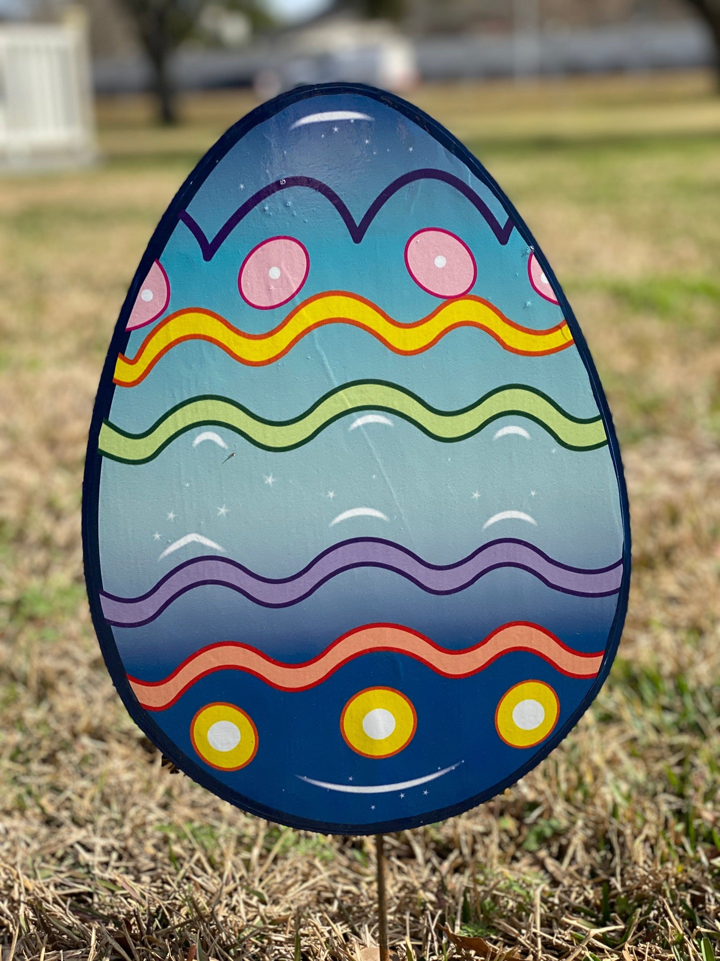 Brown Bunny holding a Happy Easter Egg Yard Sign