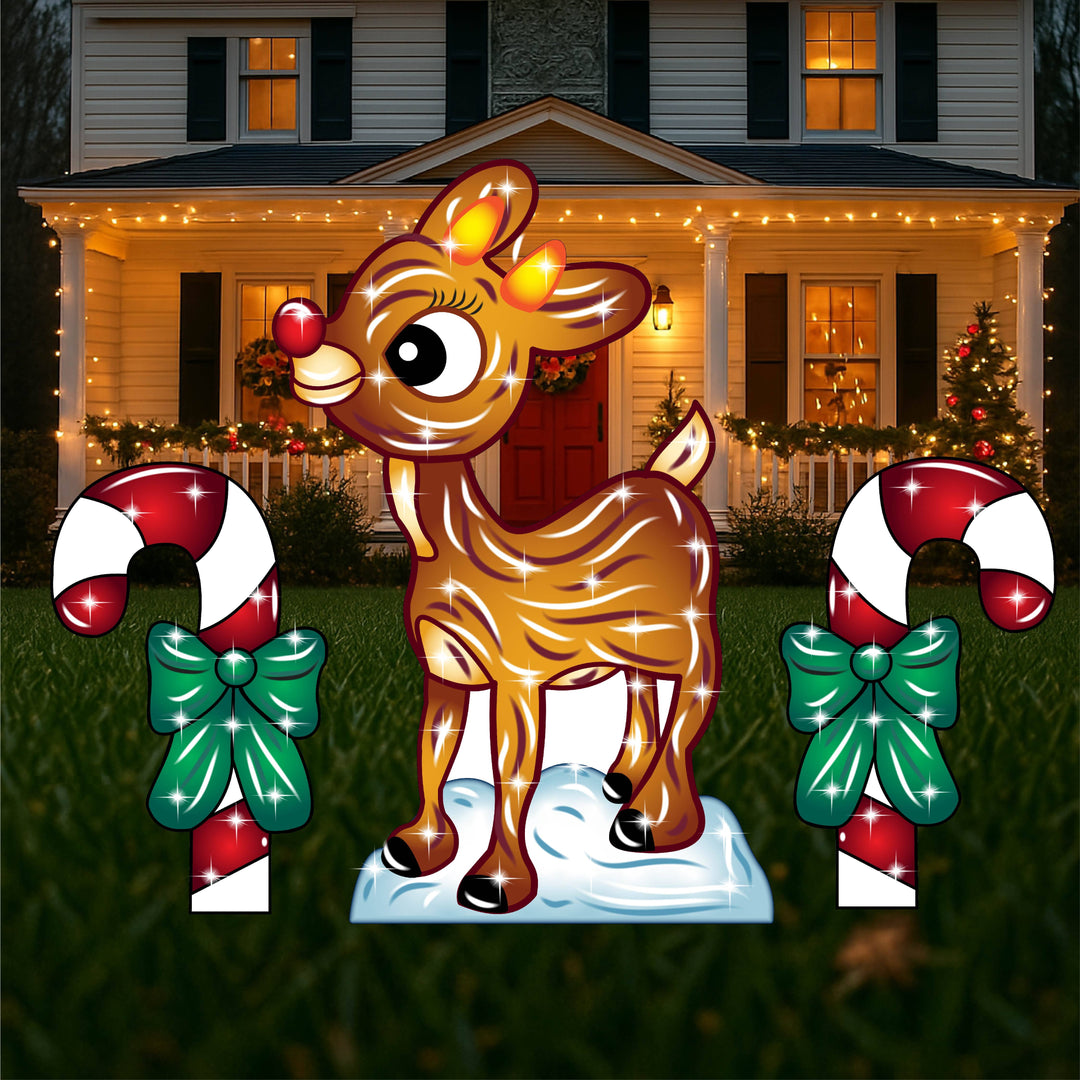 Traditional Outdoor Christmas Yard Decorations and signs featuring Rudolph the rednosed reindeer and 2 candy canes. Metal Christmas lawn signs with stakes and sparkles for sale at Yard Art Decor and More.