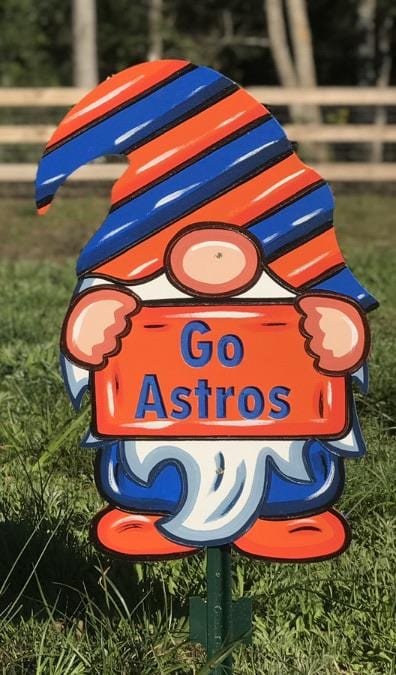 Spring and Summer Yard Gnome sign with stakes featuring a baseball theme. Gnome is wearing Houston Astros colors holding a sign that says Go Astros. Custom gnome lawn decor available at Yard Art Decor and More. 
