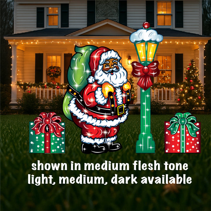Outdoor Christmas yard sign featuring a colorful illustration of Santa Claus with a green bag, standing next to a lamp post, with presents on the ground. The image shows different sizes of the yard sign with the option to choose light flesh or dark available.