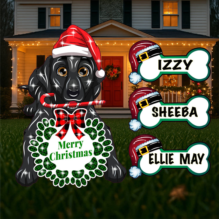 Black Dog sits with a Christmas Wreath