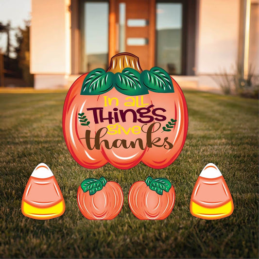 Always Give Thanks Yard Sign with Fall Pumpkins and Candy Corns Outdoor Scene