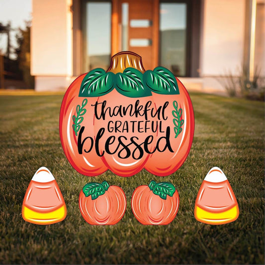 Grateful Thankful Blessed Yard Sign with Fall Pumpkins and Candy Corns Outdoor Scene