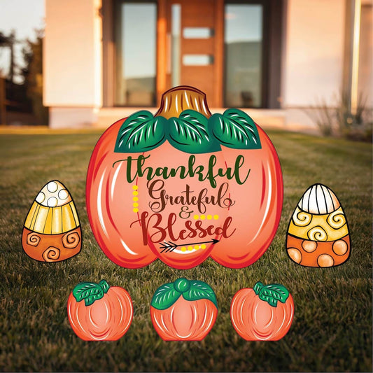 Grateful Thankful Blessed with Arrows Yard Sign with Fall Pumpkins and Candy Corns Outdoor Scene