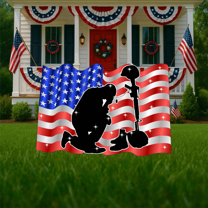 Patriotic, moving yard art sign of a kneeling soldier in front of an American Flag.  Red, white and blue lawn decorations for military, Veteran's Day, Memorial Day.  Outdoor yard signs. 