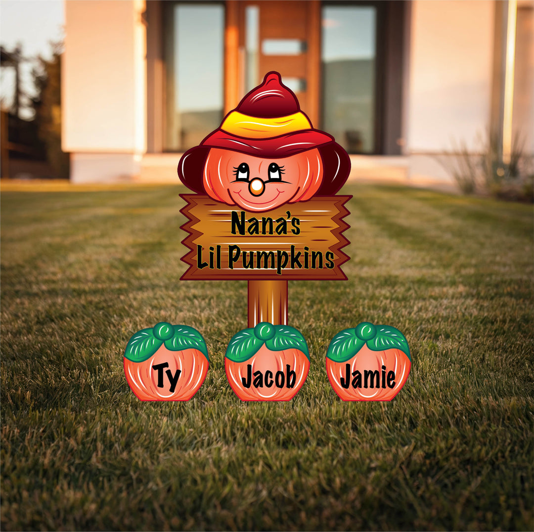 Decorative, personalized/custom pumpkin sign with names on a grassy lawn