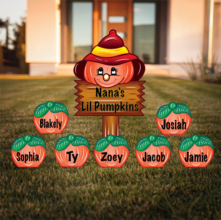 Customized Thanksgiving outdoor decorative yard signs. Main sign is a sign that reads "Nana's Lil Pumpkins." Also featured are smaller pumpkin yard signs personalized with the names of grandkids on them. Personalize your Thanksgiving outdoor decorations with these adorable pumpkins from Yard Art Decor and More. 