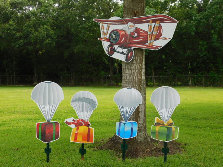 Santa in Air Plane with parachute presents
