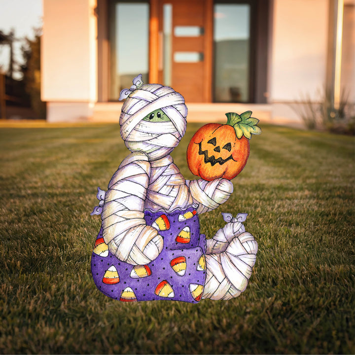 Mummy sits Holds Pumpkin Halloween Yard Art