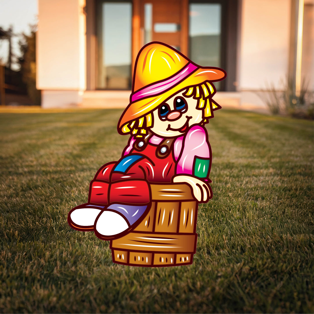 Scarecrow sitting in a bucket Halloween yard art
