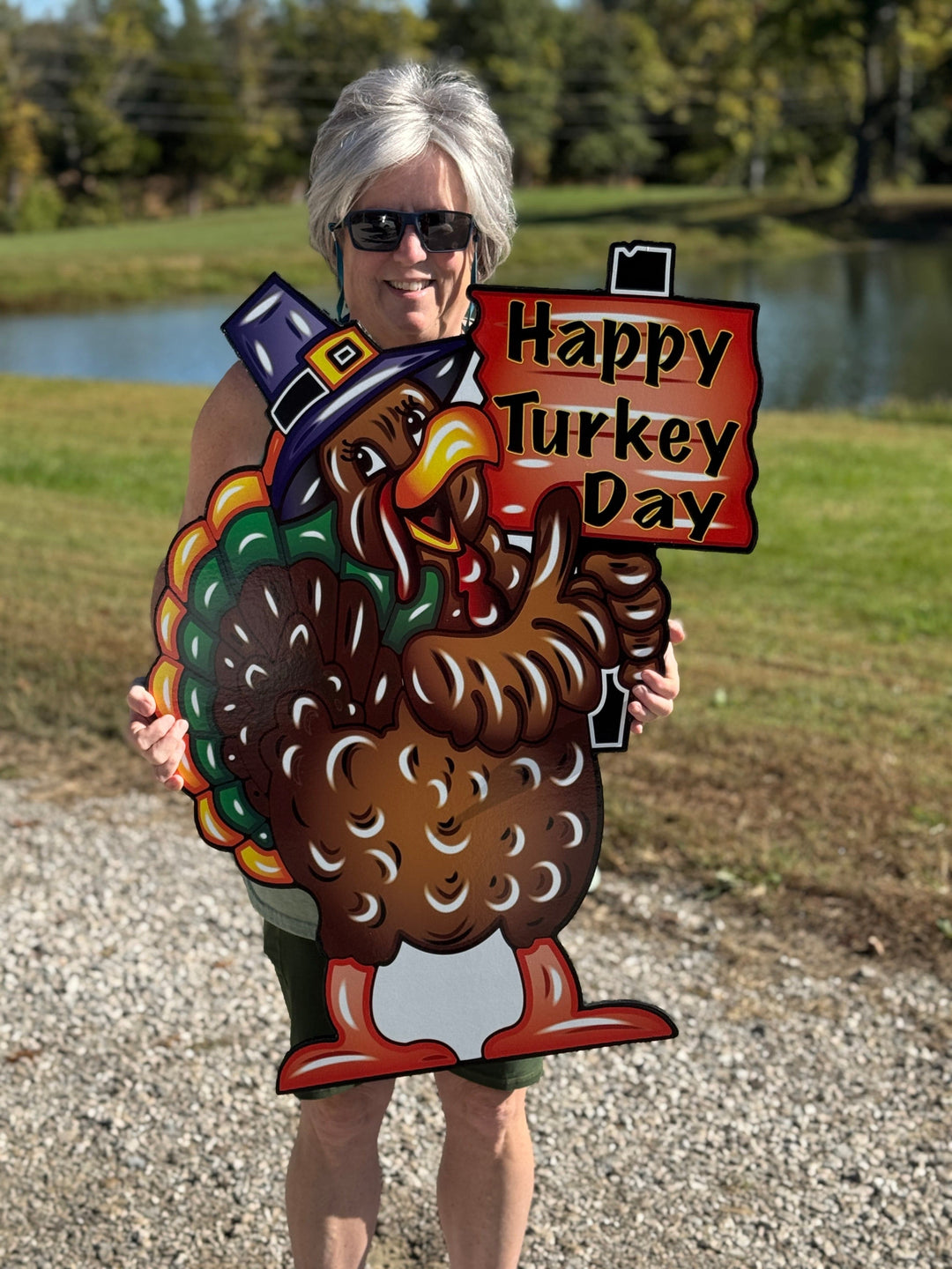 Turkey with Happy Turkey Day Sign