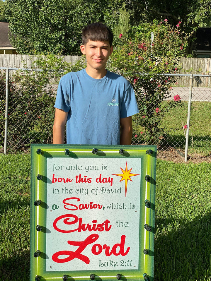 Lighted Luke 2:11 sign with red border Christmas yard art