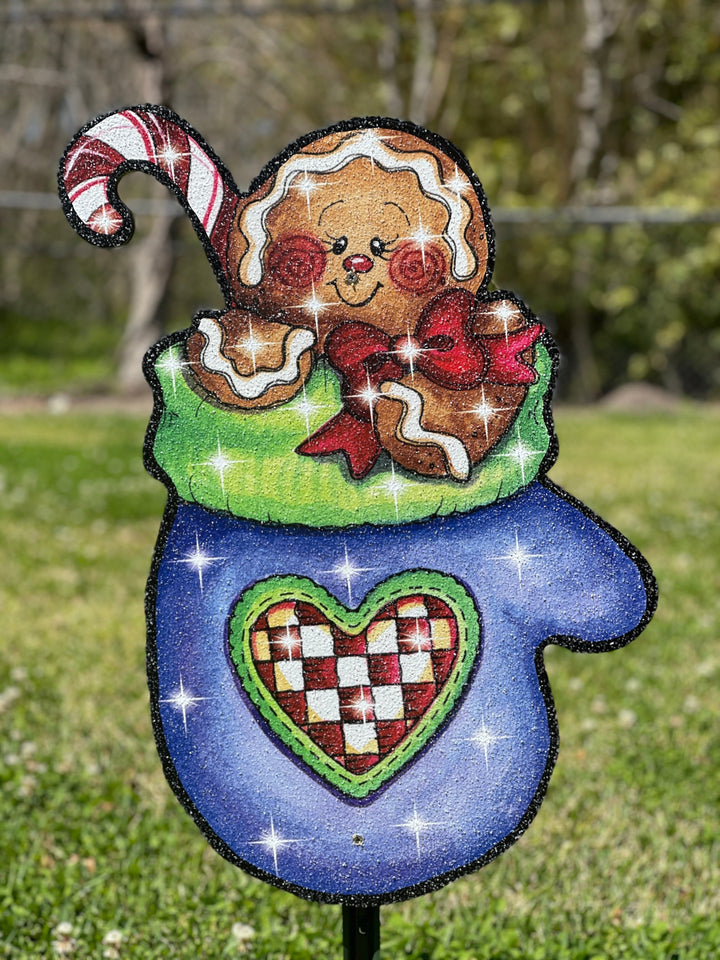 Cute gingerbread man in a blue mitten outdoor yard decor sign. 