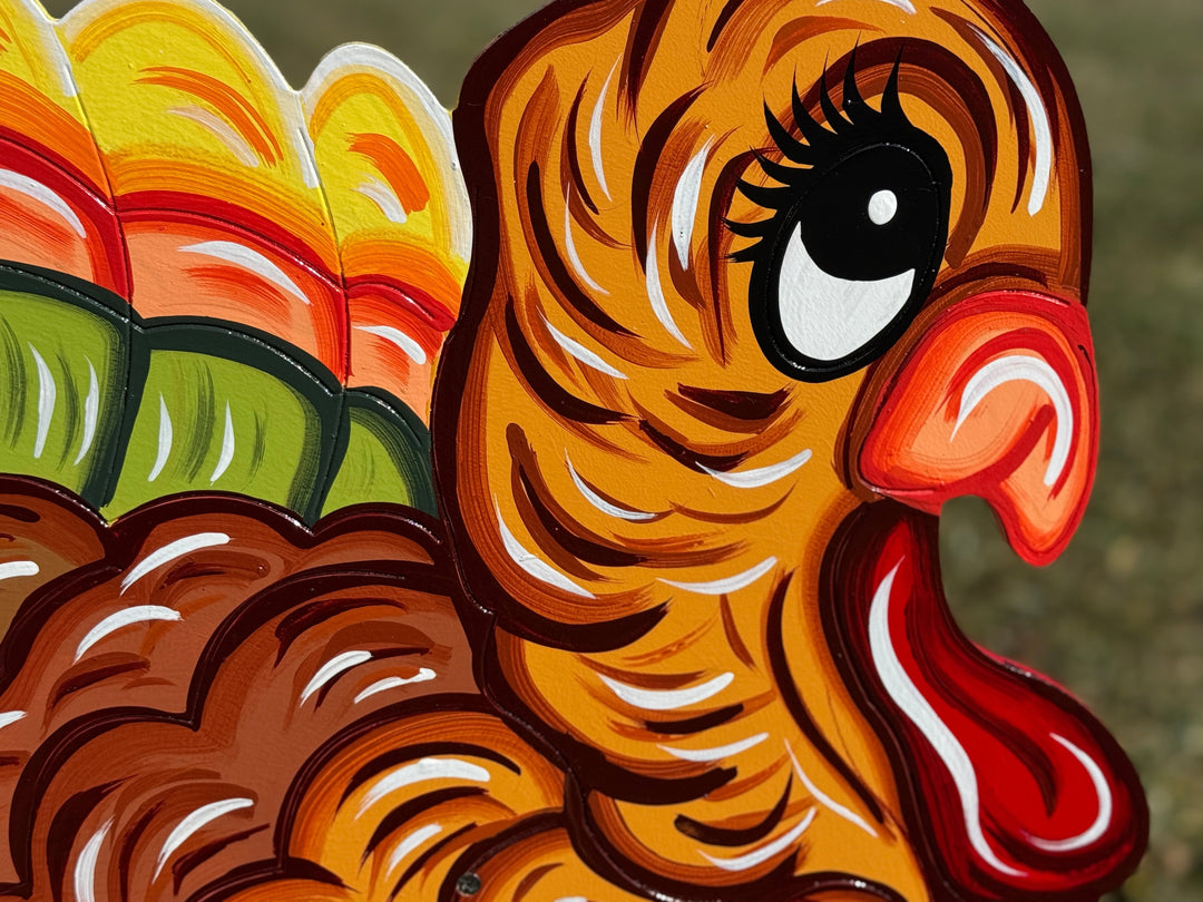 Closeup of the head of the outdoor turkey yard sign for fall, autumn and/or Thanksgiving lawn decor.  Decorate your outdoor space this Thanksgiving with cute Turkey yard signs. 
