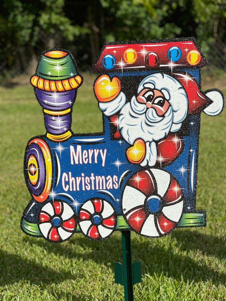 Santa driving a Christmas Train yard art decoration