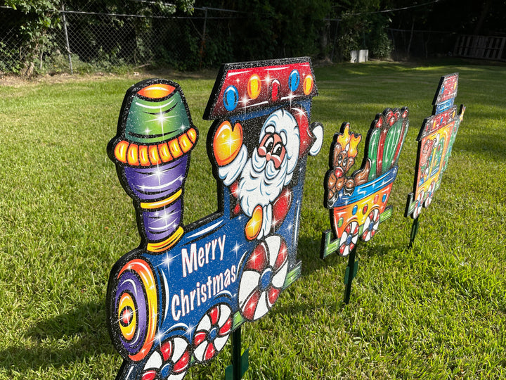 Santa driving a Christmas Train yard art decoration