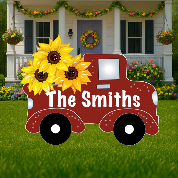 Example of personalized red truck yard art sign. Truck currently says "The Smiths" but it can be customized to any saying or last name. Personalized lawn and yard art and decor available at Yard Art Decor and More. 