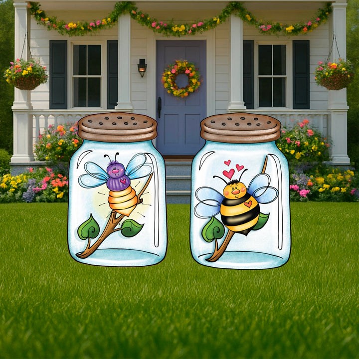 Set of 2 decorative yard signs. One is a honeybee in a jar adorned with cute hearts and the other is a dragonfly. Both are perched on a stick with 2 green leaves. Cute insect lawn decorations for yards, gardens, pathways or flowerbeds. Perfect summer outdoor space decorations. 