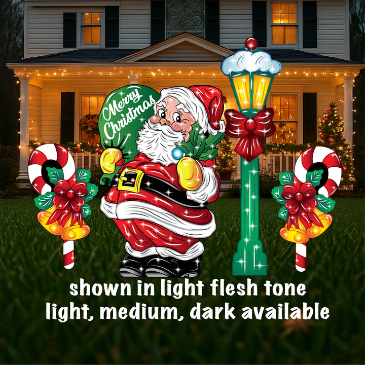 Festive Christmas outdoor lawn decor signs. Decorate for the Holiday Season with this jolly santa holding a green gift bag that reads Merry Christmas. Santa is in a light flesh tone. Also available are darker skin colors. 