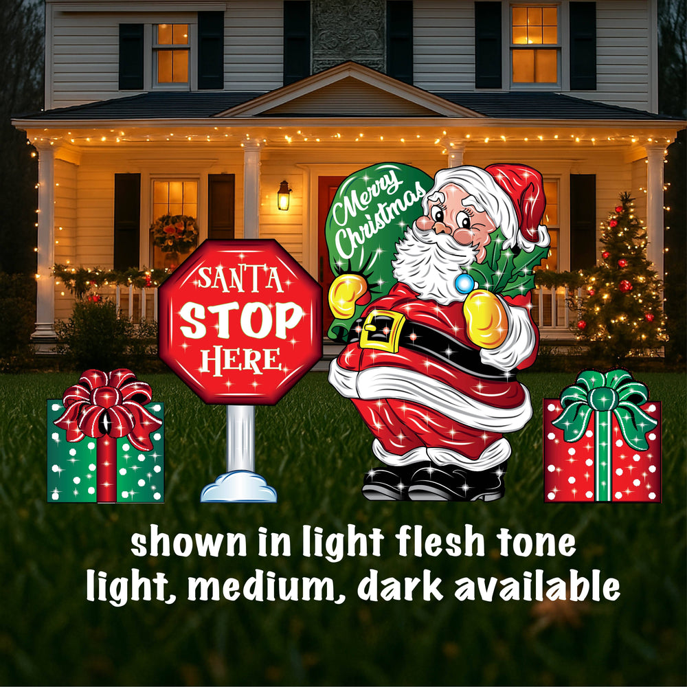 Christmas Holiday Outdoor Yard Sign Decoration featuring a jolly Santa holding a green gift bag that says Merry Christmas, a stop sign that reads "Santa Stop Here" and 2 presents gift wrapped - one in green with a red bow, one in red with a green bow. Decorate your outdoor space with traditional hand crafted yard art signs with stakes. 