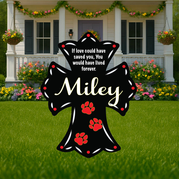 Personalized outdoor pet memorial cross for yards, gardens, porches, walkways and more. Add a custom quote, your pet's name and date of birth and more. Custom yard cross to honor a pet that has crossed the rainbow bridge in black with white letters and red paw prints. Memorial crosses for pets and family available for sale at Yard Art Decor and More. 