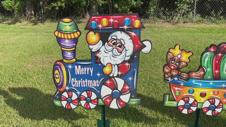 Santa driving a Christmas Train yard art decoration