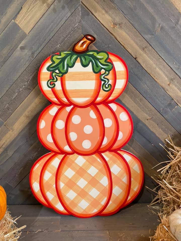 triple stacked pumpkin with stripes, polka dots, and plaid pattern painted yard art design
