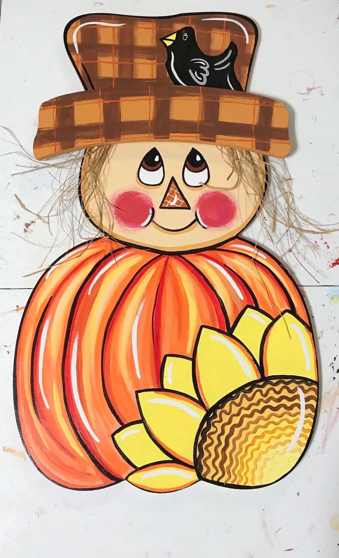 scarecrow face on pumpkin painted yard art design