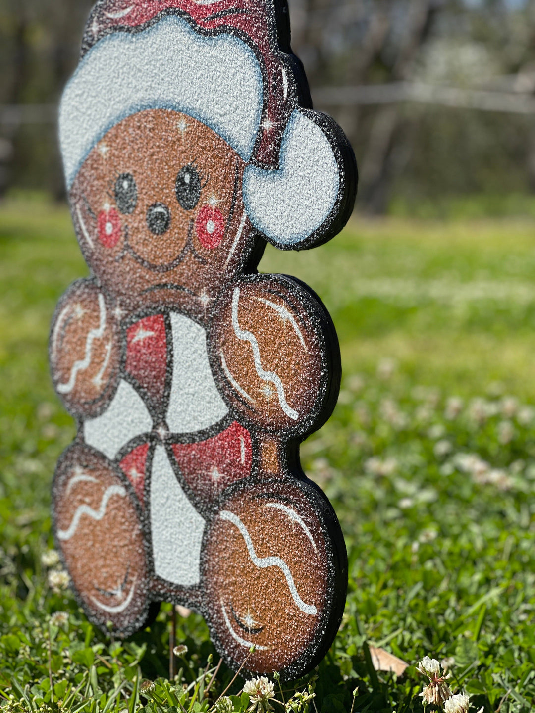 Christmas gingerbread kid with peppermint yard decor