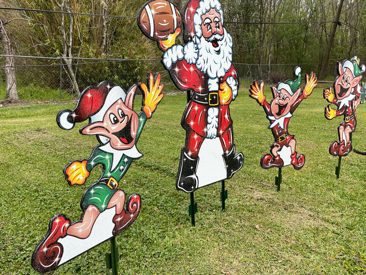 Santa Claus plays Football with Elves Yard Decoration