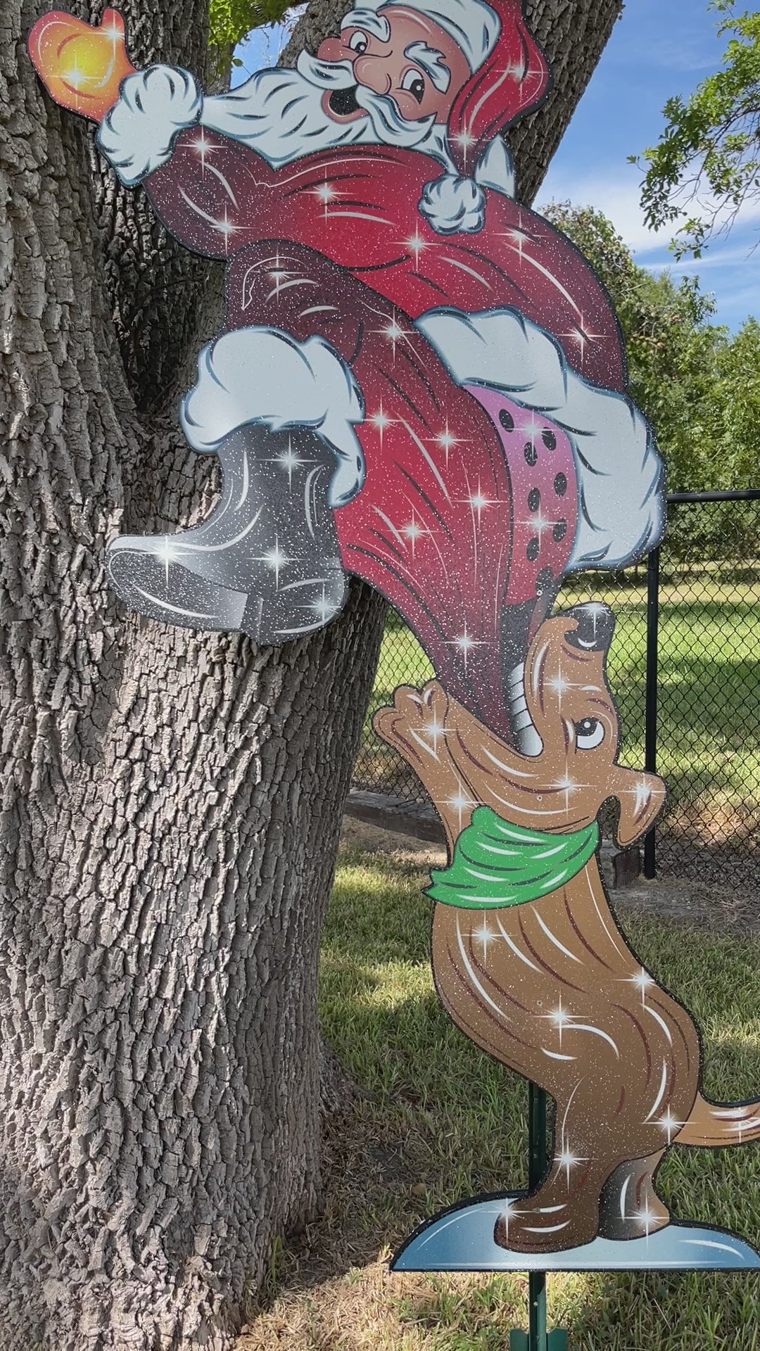 Dog Bites Santa on the Bottom Christmas Yard Art Decoration
