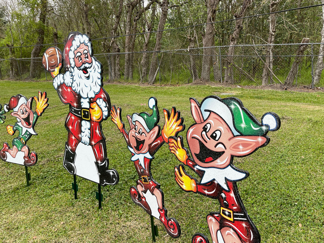 Santa Claus plays Football with Elves Yard Decoration