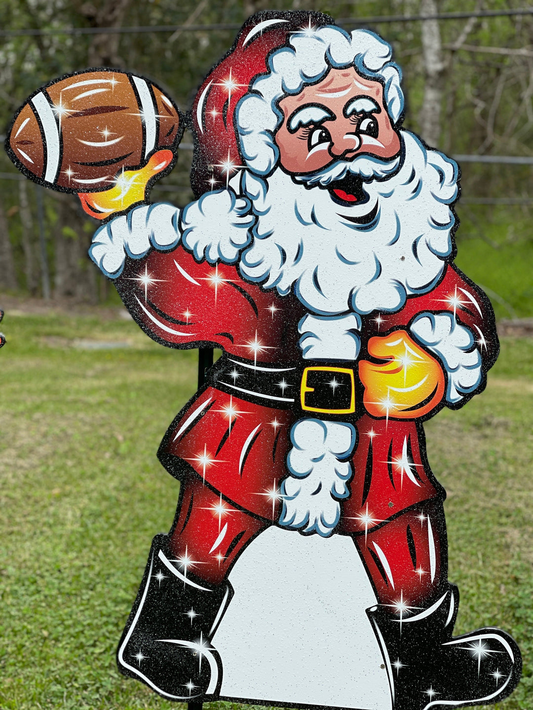 Santa Claus throwing a Football Yard Decoration