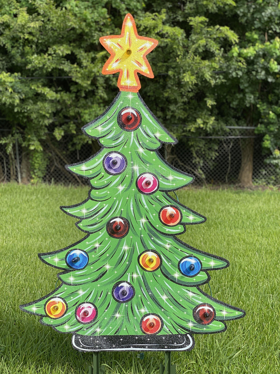 lighted Christmas tree yard art