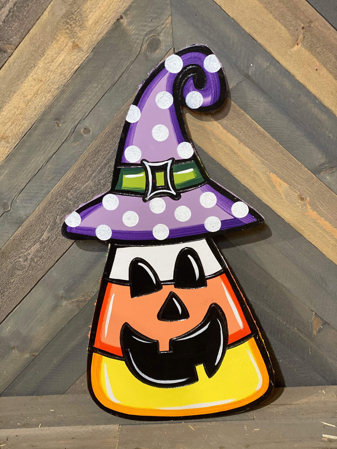 candy corn with witch's hat and face painted yard art design