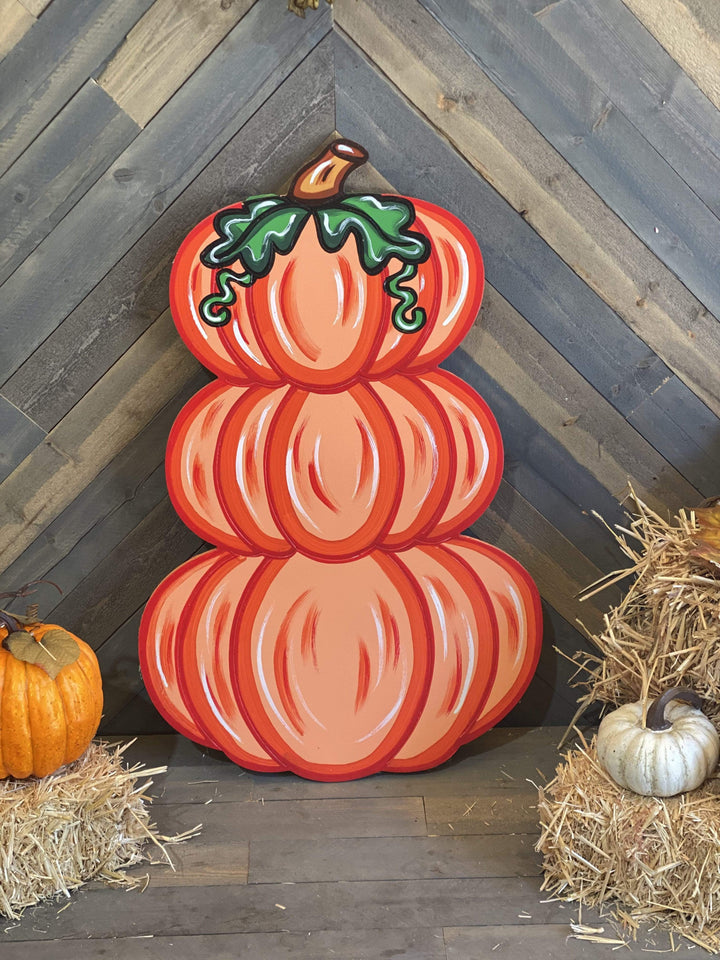 triple stacked orange pumpkin painted yard art design