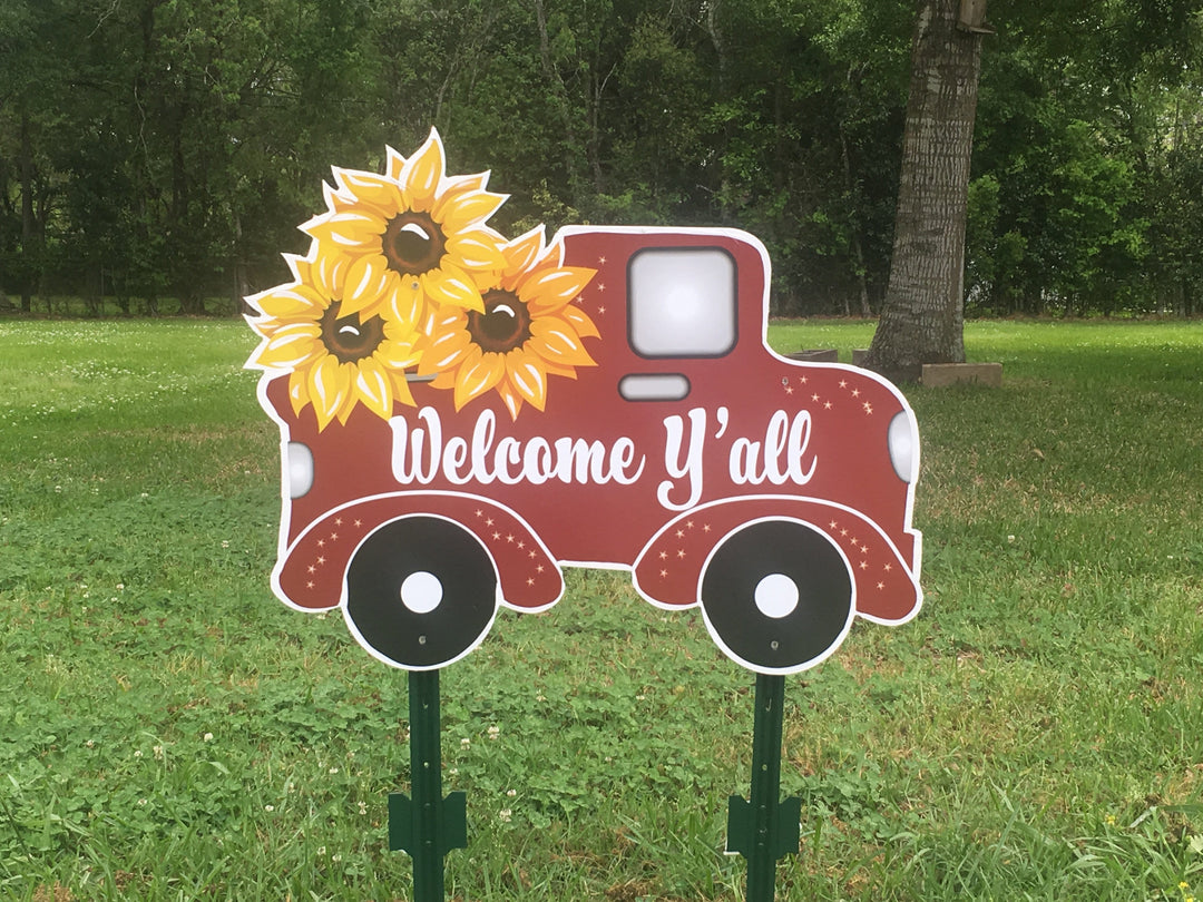 red welcome truck yard art