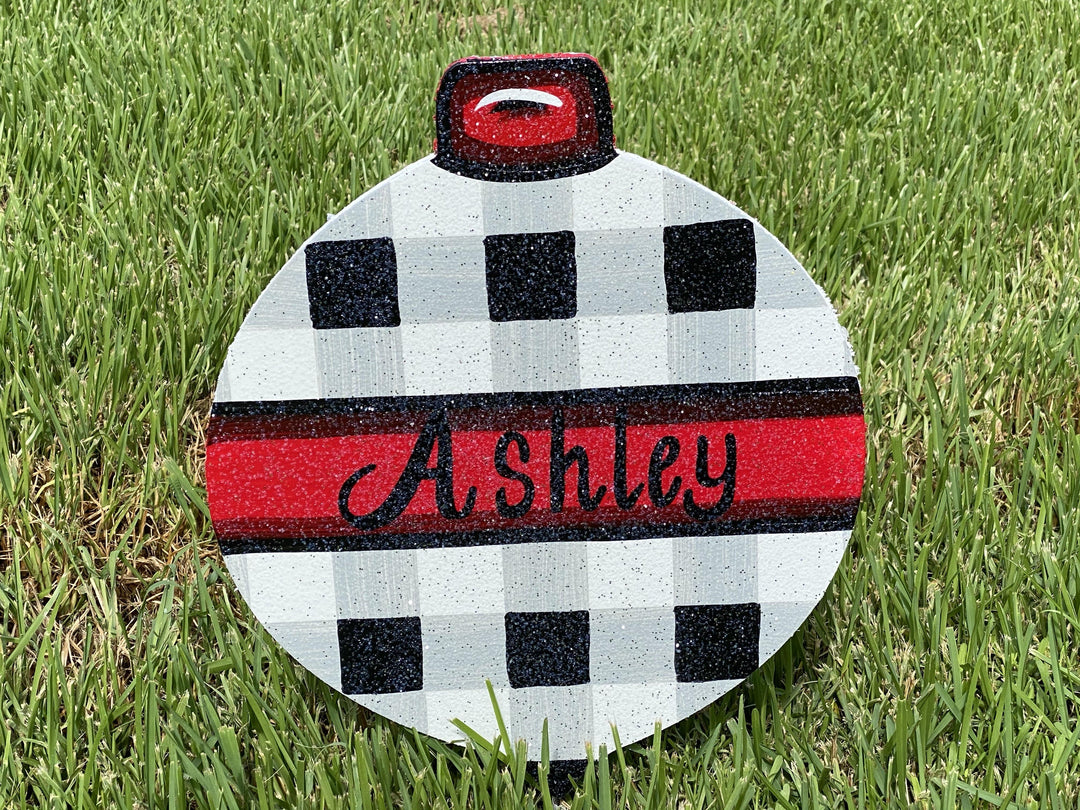 Christmas Ornament yard art with checkered pattern and name