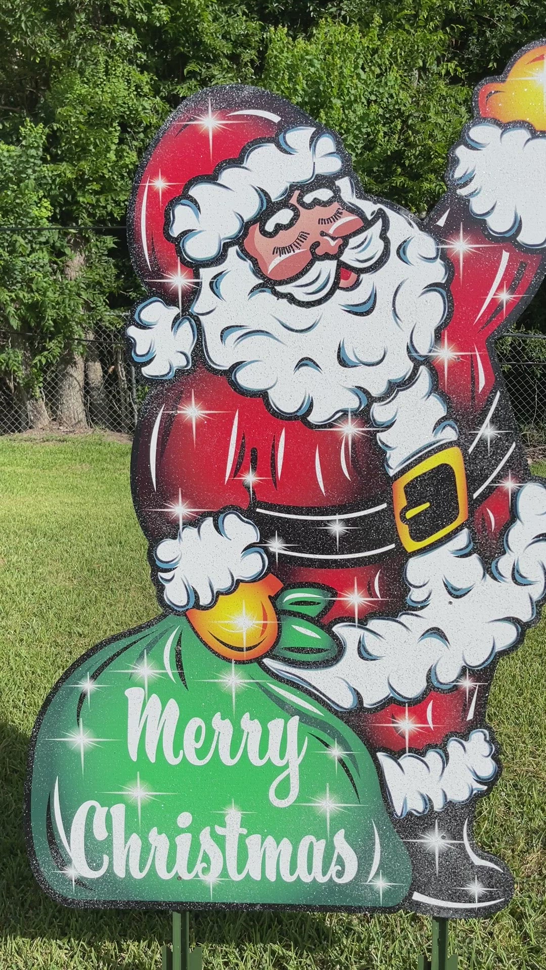 Santa Waving with a green bag