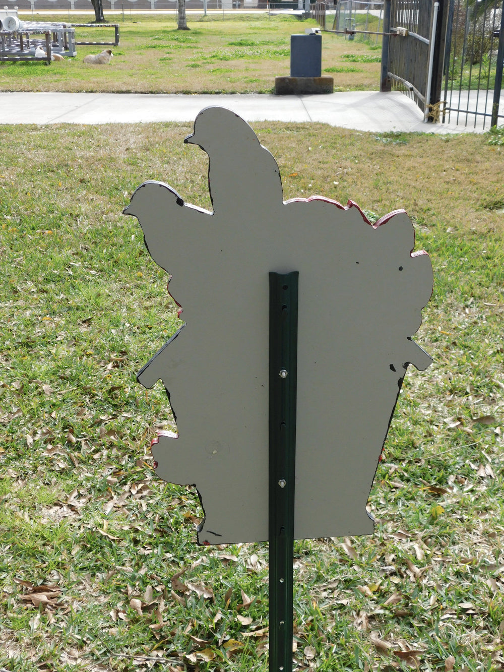Back of bird house yard sign showing solid paint color and metal stake for easy placement in a yard, garden or walkway. 