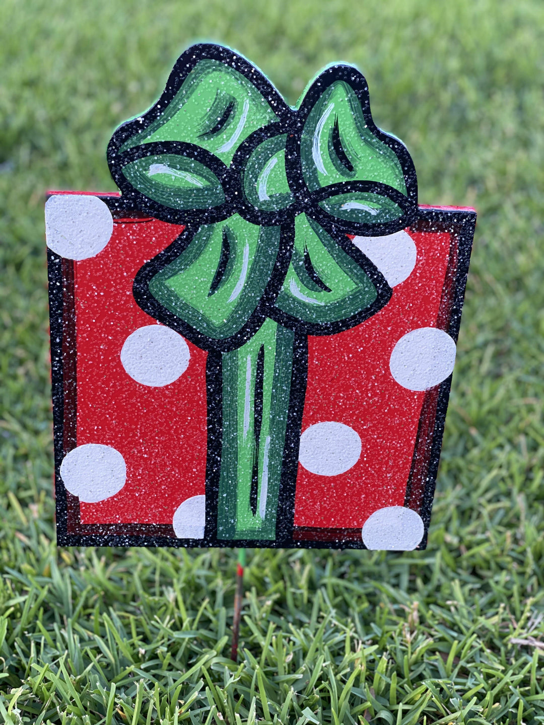 Christmas present with verticle bow painted yard art design