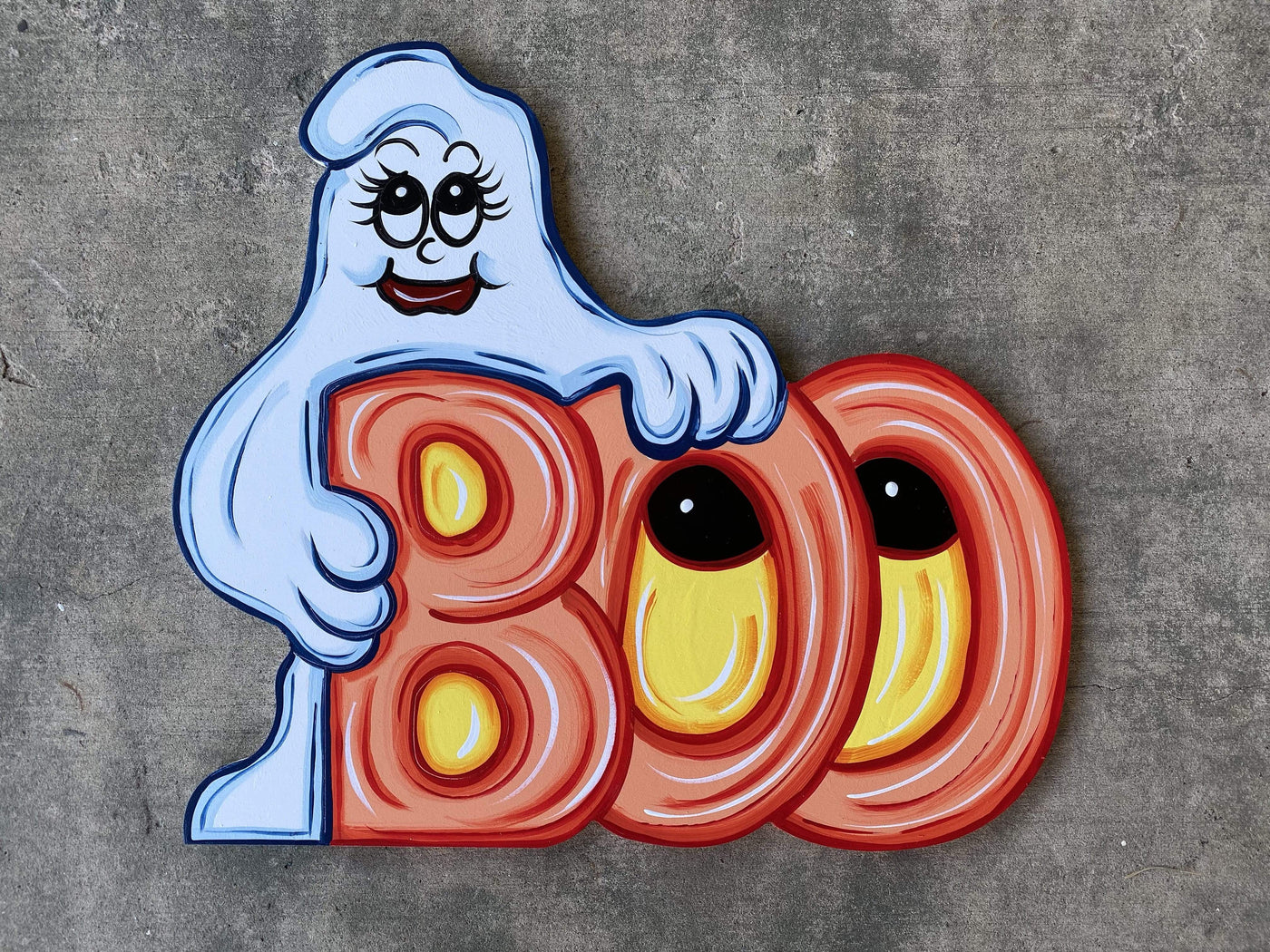 ghost hoilding boo letters with eyes painted yard art design