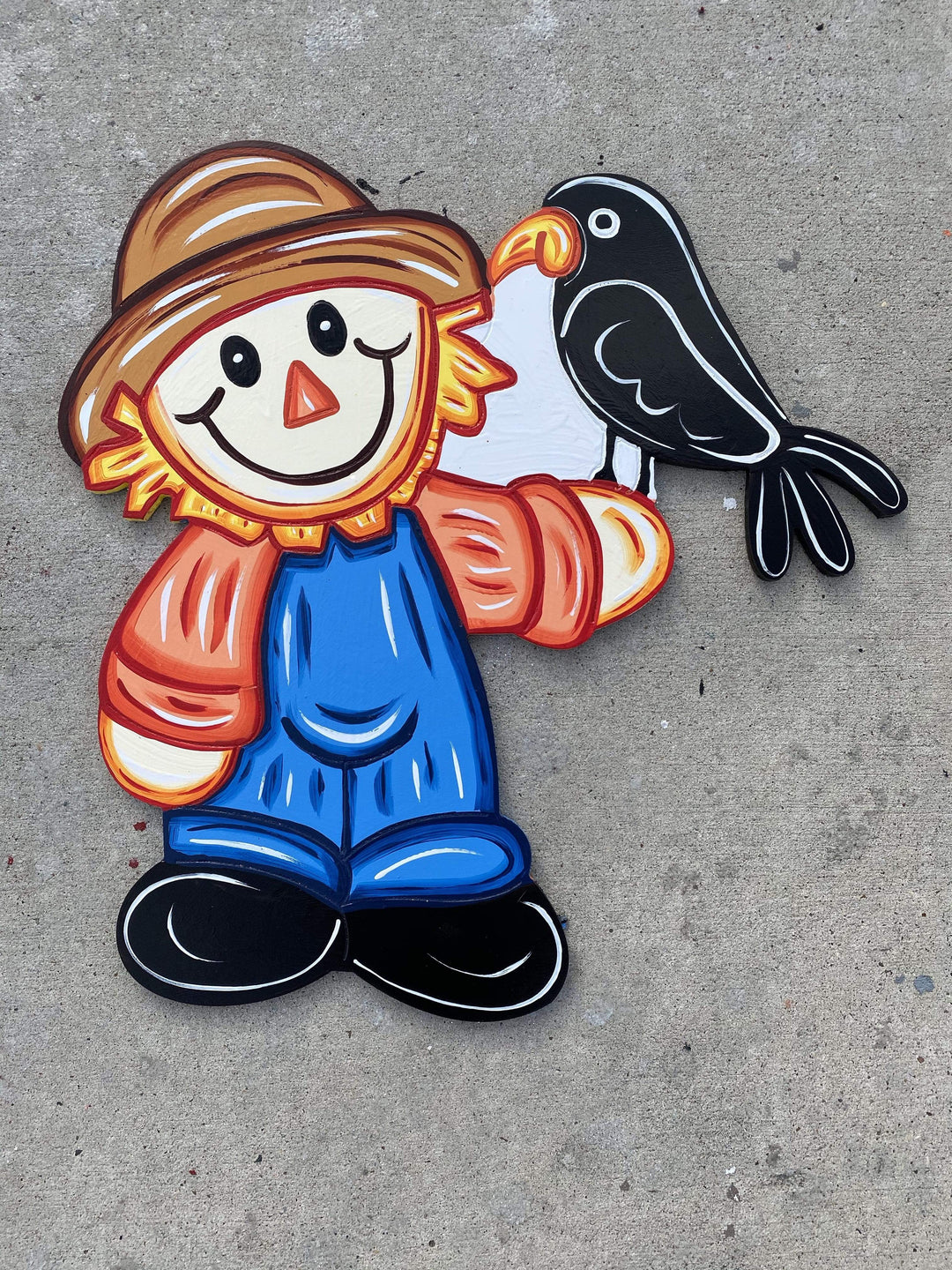 scarecrow with crow painted yard art design